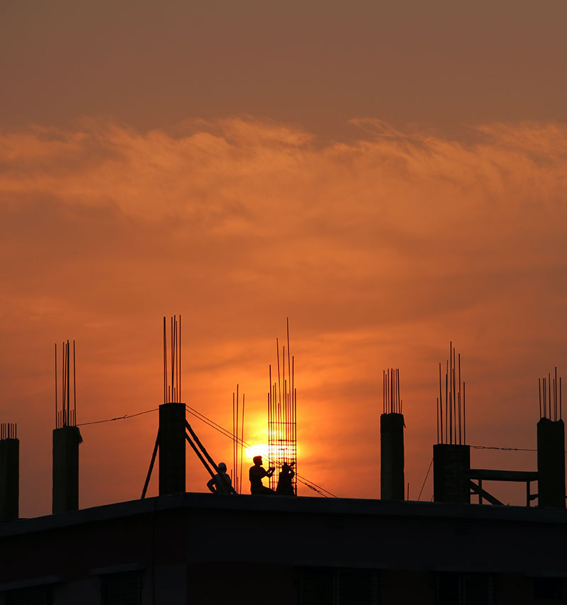 silhouette-of-men-in-construction-site-during-sunset-176342